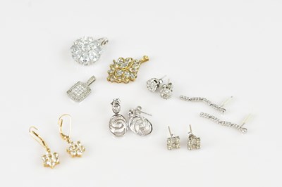 Lot 1397 - Four pairs of white metal diamond set earrings,...