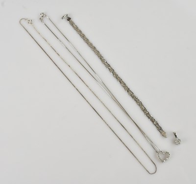 Lot 2183 - A white and yellow metal diamond set heart...