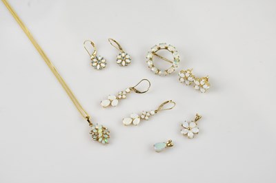 Lot 2193 - A 9ct yellow gold opal set openwork brooch,...