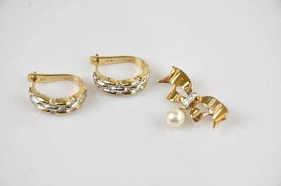 Lot 1398 - A 9ct yellow gold diamond and pearl set bow...
