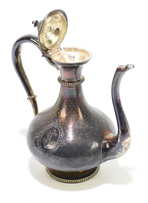 Lot 2502 - A 19th century white metal oil ewer decorated...