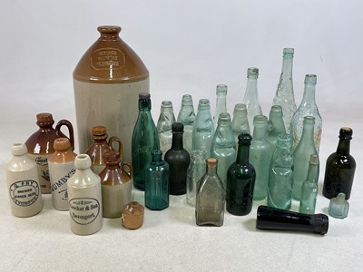 Lot 383 - A quantity of ginger beer bottles, flagons and...