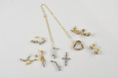 Lot 1412 - A yellow metal heart shaped multigem set...