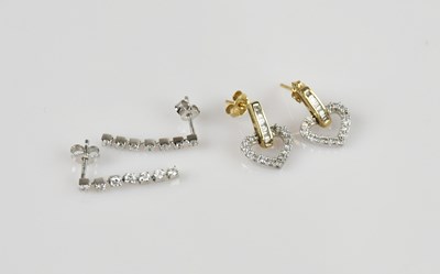 Lot 1406 - A pair of 18ct white gold diamond set seven...