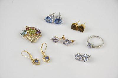 Lot 2185 - A 9ct yellow gold pendant, set with multigems...