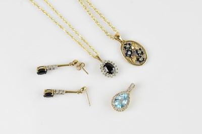 Lot 2186 - A 9ct yellow gold diamond and sapphire...