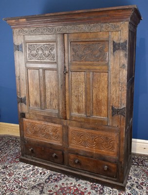 Lot 2946 - An 18th century and later oak livery cupboard,...