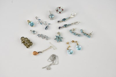 Lot 2211 - A 9ct white gold diamond and pale blue stone...