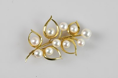 Lot 1296 - A Chinese yellow metal pearl set brooch,...