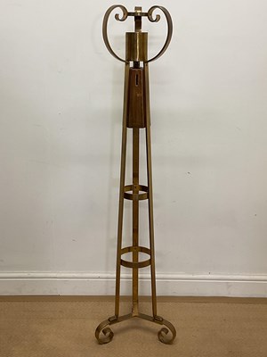 Lot 311 - A mid 20th century brass floor standing altar...