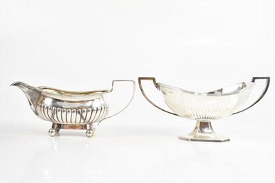 Lot 251 - I E T; a Georgian hallmarked silver sauceboat,...