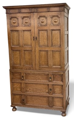 Lot 69 - A 1920s oak linen press converted to a...