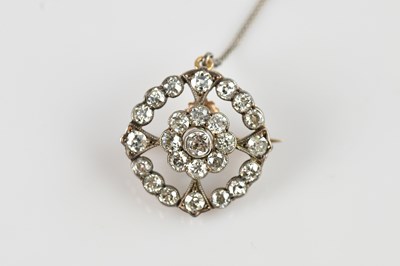 Lot 1275A - An Art Deco diamond set circular brooch, set...