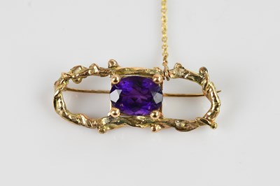 Lot 1293A - A yellow metal textured rectangular brooch,...