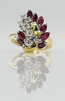 Lot 647 - An 18ct yellow gold ruby and diamond cocktail...