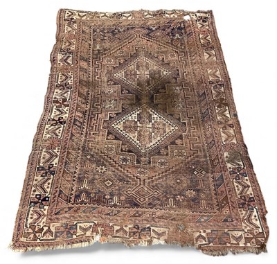 Lot 135 - An antique Persian carpet, with central...