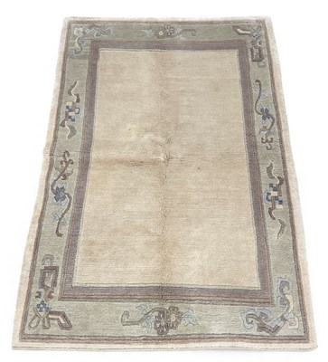 Lot 142 - A modern Indian hand knotted cream ground...