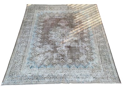 Lot 119 - A large Persian red ground carpet, with...