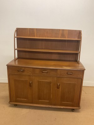 Lot 945 - PRIORY FURNITURE; an oak sideboard with plate...