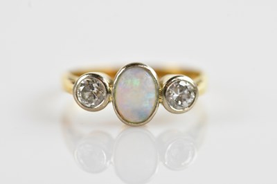 Lot 632 - An 18ct yellow gold opal and diamond ring,...