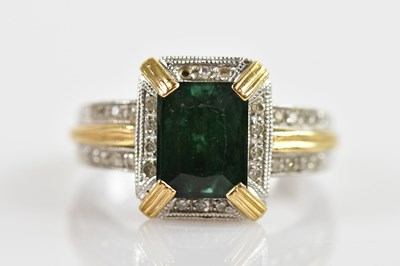 Lot 653 - An 18ct yellow and white gold ring, with...