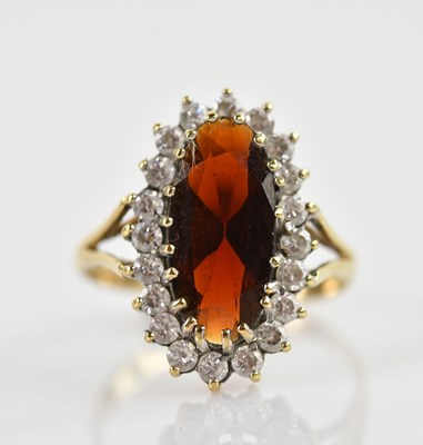 Lot 652 - A 9ct yellow gold cluster ring with central...