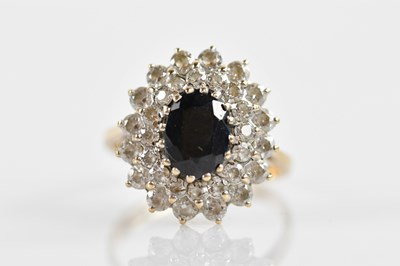 Lot 639 - A 9ct yellow gold cluster ring with central...