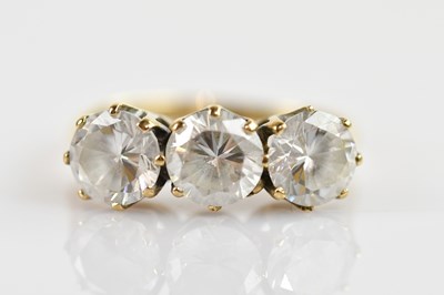 Lot 667 - An 9ct yellow gold dress ring set with three...