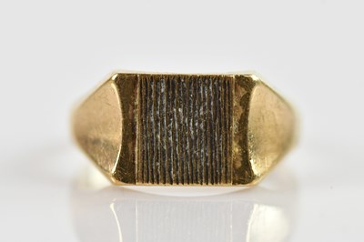 Lot 643 - A 9ct yellow gold gentleman's ring, size U 1/2,...