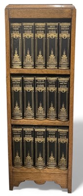 Lot 114 - A 1920s oak narrow bookcase containing fifteen...