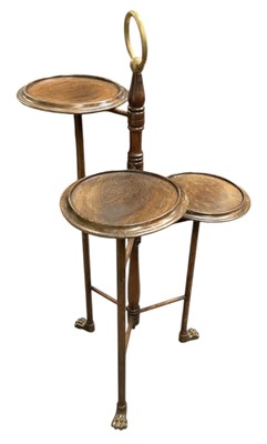 Lot 77 - An Edwardian brass and mahogany three tier...