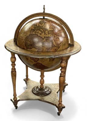 Lot 43 - A reproduction revolving freestanding drinks...