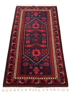 Lot 127 - An early 20th century Turkish hand woven red...