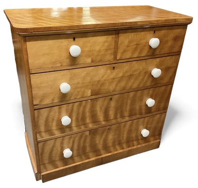 Lot 62 - A Victorian satin maple chest of two short...