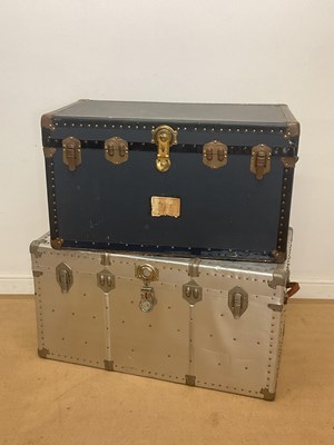 Lot 50 - Two large travel trunks, comprising an...