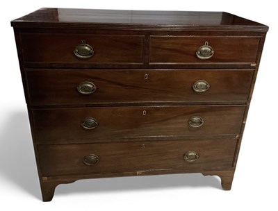 Lot 61 - An early 19th century mahogany chest of two...