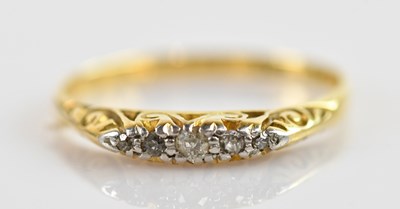 Lot 670 - An 18ct yellow gold and five stone diamond...
