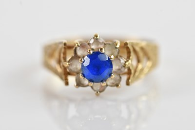 Lot 679 - A 9ct dress ring with blue glass stone, size O,...