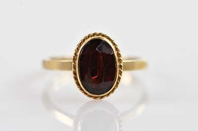 Lot 668 - A 9ct yellow gold dress ring with central...