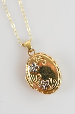 Lot 617 - A yellow metal locket on 9ct yellow gold chain,...