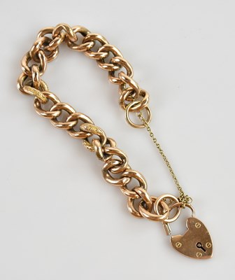 Lot 589 - A 9ct yellow gold hollow curb link bracelet,...