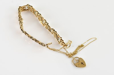 Lot 587 - A 9ct yellow gold gate link bracelet with...