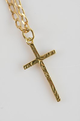 Lot 608 - A 9ct yellow gold cross pendant on 9ct gold...