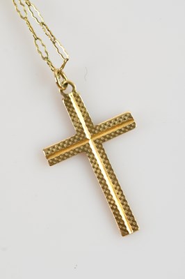 Lot 619 - A 9ct yellow gold cross, approx 1.3g, on a...