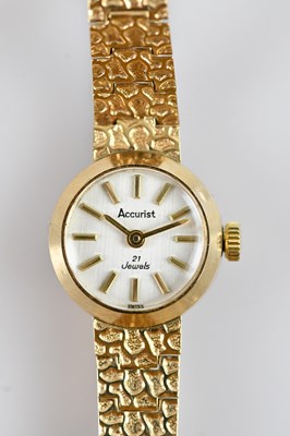Lot 702 - ACCURIST; a 9ct yellow gold lady's cocktail...