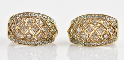 Lot 620 - A pair of 9ct yellow gold clip earrings,...