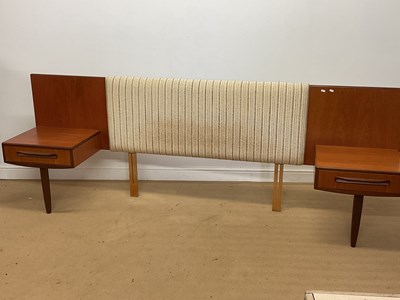 Lot 879 - G PLAN; a Fresco teak double headboard with...
