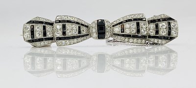 Lot 642 - A fine Art Deco white metal diamond and black...