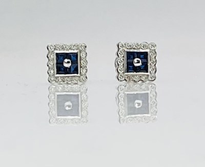 Lot 662 - A pair of 18ct white gold diamond and sapphire...