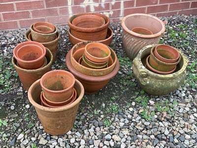 Lot 857 - A quantity of terracotta plant pots of various...
